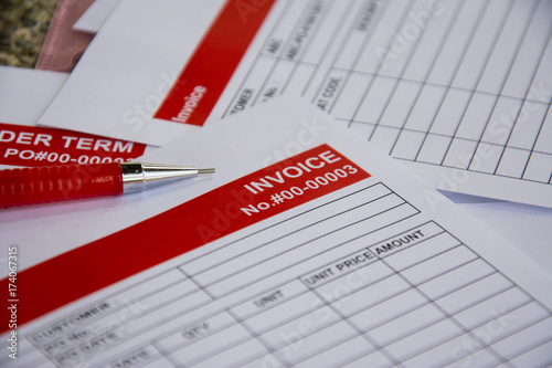 the red pencil put on the invoice red tab paper close up background