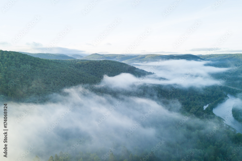 Fototapeta premium Sunset in the Ural mountains in Karatash ridge. Flying by drone