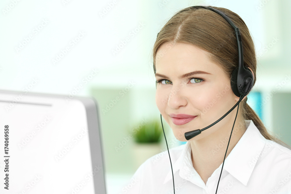 Young female technical support dispatcher working in office Young female technical support dispatcher working in office