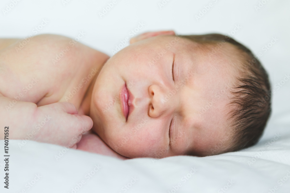 Newborn Baby Girl Sleeping on Soft White Newborn Baby Girl Sleeping on Soft White
