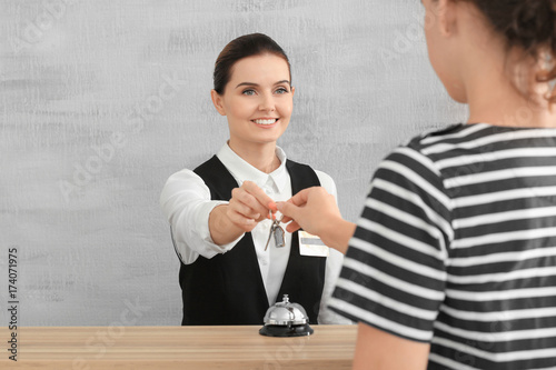 Female receptionist giving ...