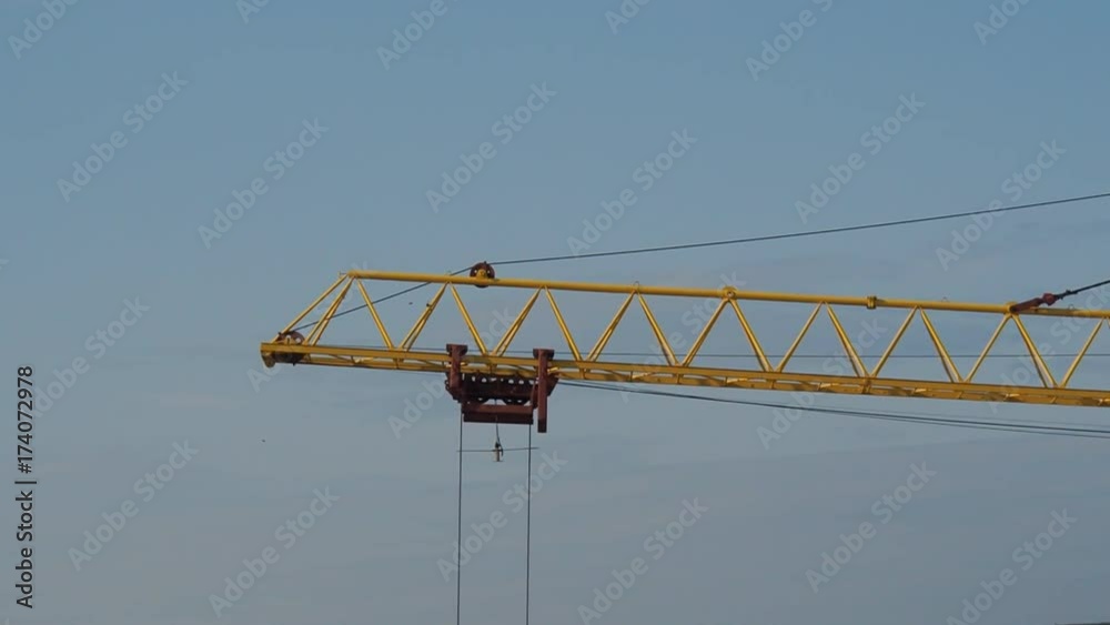 Construction crane. Work of the carriage of the construction crane. Construction crane. Work of the carriage of the construction crane.