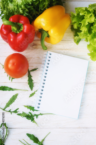 bell pepper, green salad and notepad
