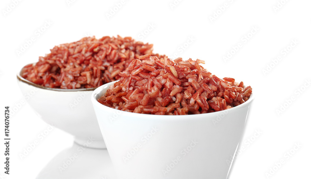 Bowls with red rice, isolated on white Bowls with red rice, isolated on white
