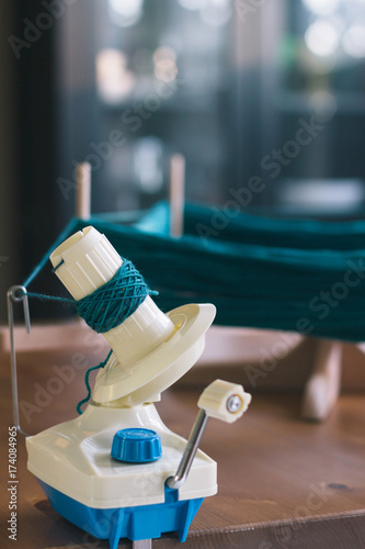 Winding skein of blue yarn