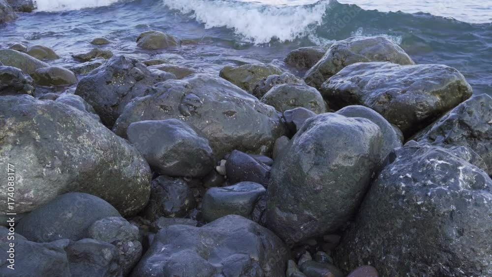 Water splashing on the rocky shore whith splash 4k Water splashing on the rocky shore whith splash 4k