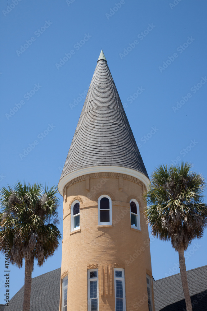 Church bell tower with palm trees