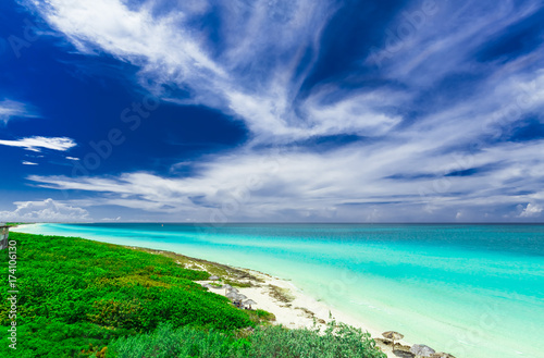 Fototapeta Naklejka Na Ścianę i Meble -  gorgeous amazing, beautiful, stunning view of tropical white sand beach and tranquil turquoise tender ocean on sunny summer day and blue magic deep, blue sky background at Santa Maria island,Cuba