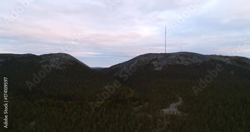 Fjeld mountain, Cinema 4k aerial sideway view of pyhatunturi fell, at a swamp, in the arctic taiga wilderess of tunturi Lapland, in Lappi, Finland photo