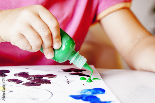 great artist (humorous picture) close up of little baby girl draws a picture paints