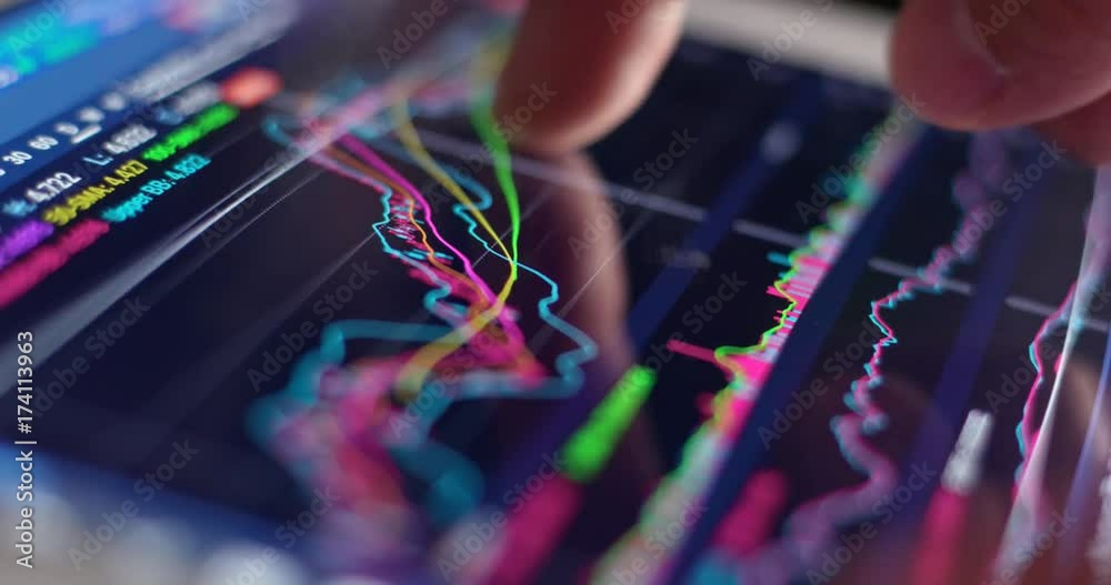 Use of digital tablet computer with stock market graph