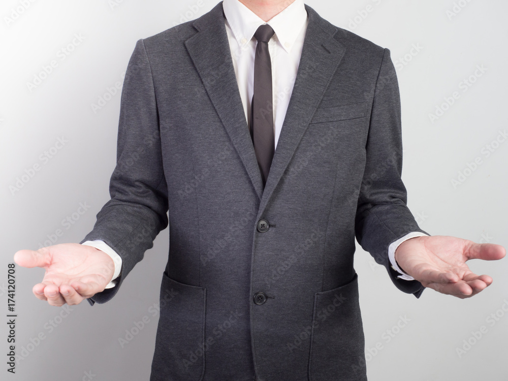 Young man giving empty hand on black background.Hands open businessman. some object are here. Young man giving empty hand on black background.Hands open businessman. some object are here.