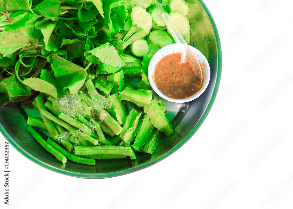 Shrimp-paste sauce and fresh vegetables herb in the tray on white background Shrimp-paste sauce and fresh vegetables herb in the tray on white background
