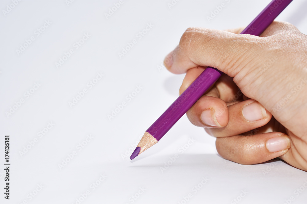 Hand holding color pencil Hand holding color pencil