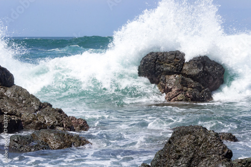 Waves crash onto volcanic rocks.  The Pacific Ocean at Playa San Juanillo, Costa Rica.