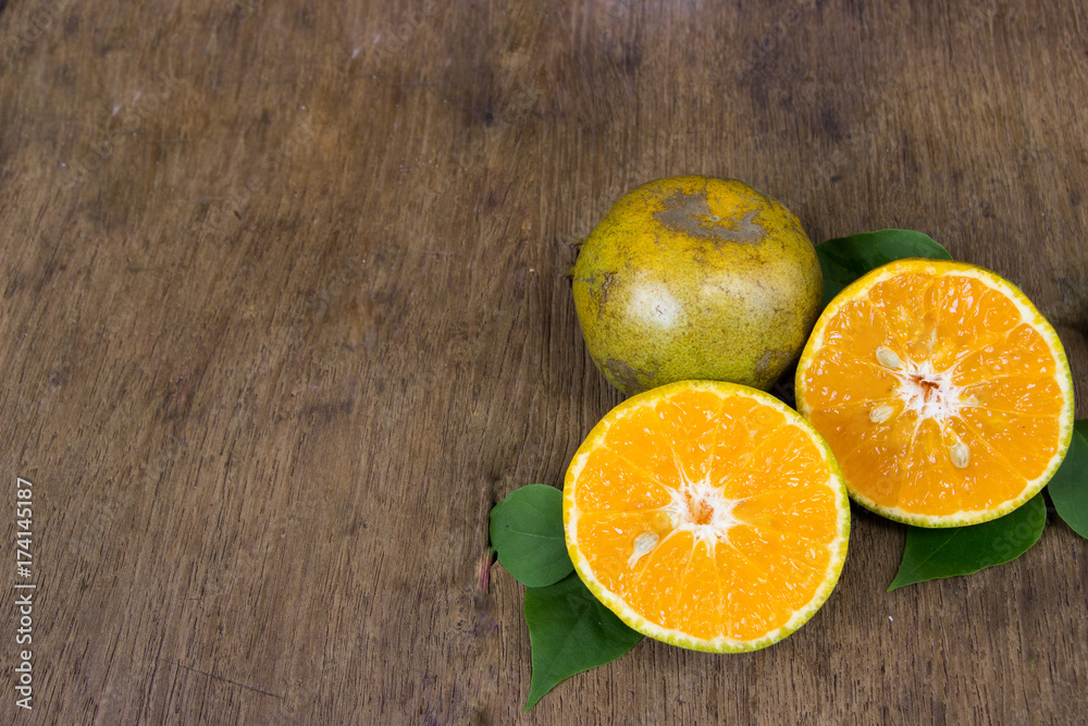 Orange  from above on wood table.