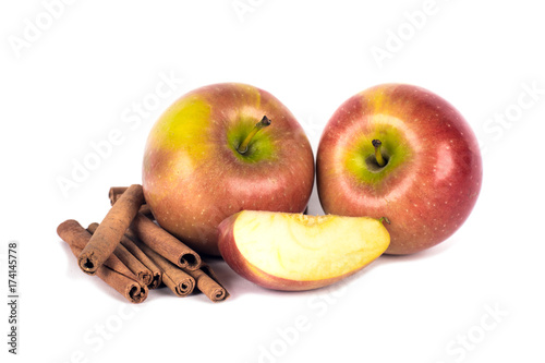 Apple with cinnamon on white