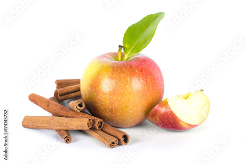 Apple with cinnamon on white