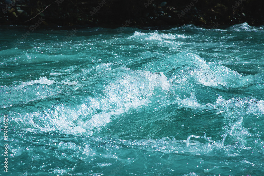 Obraz premium Crystal clear glacial water of the river of turquoise color