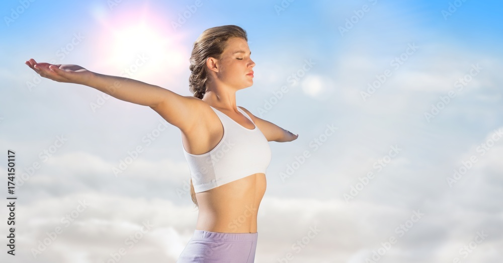 Woman arms outstretched against sunny sky Woman arms outstretched against sunny sky