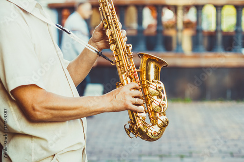 Wall Mural saxophonist plays on the street
