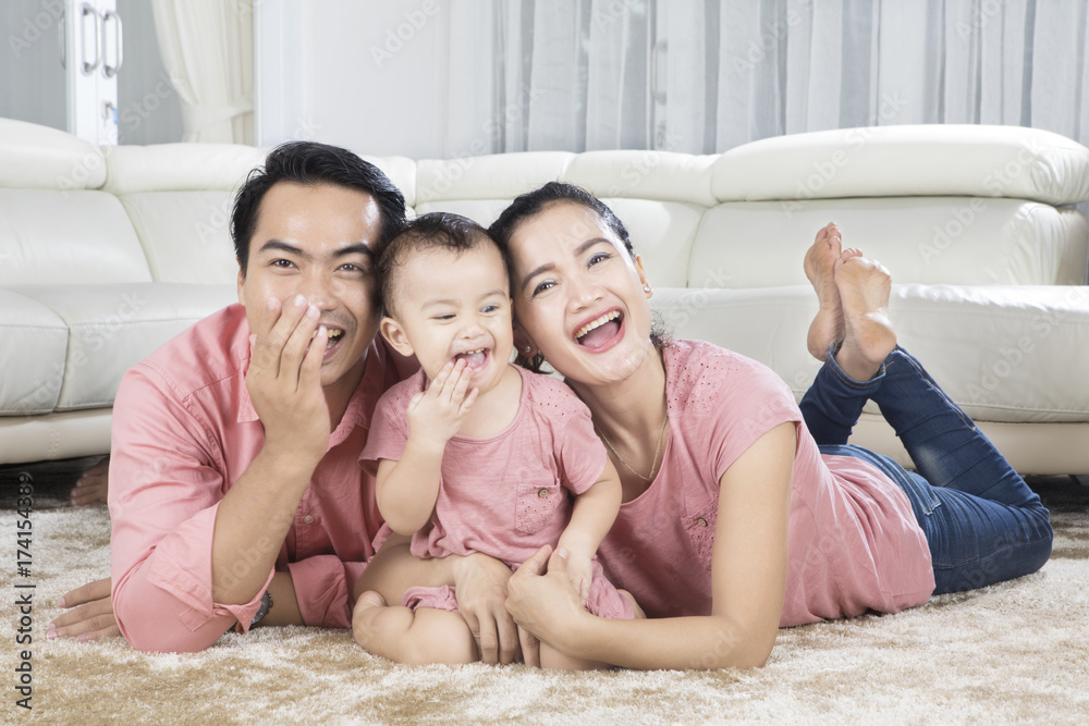 Cute baby having fun with her parents Cute baby having fun with her parents
