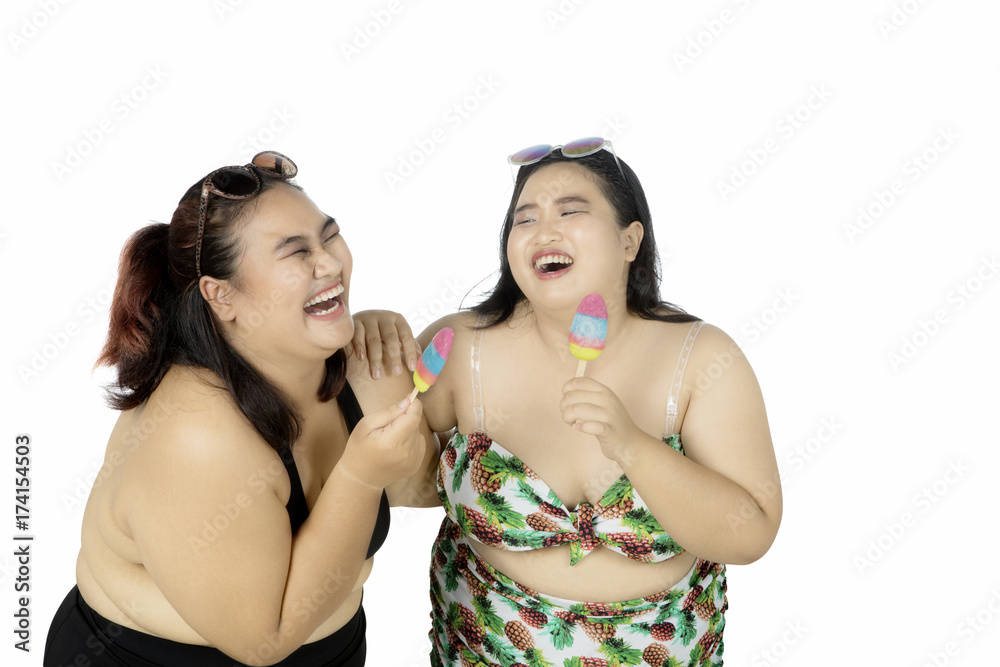 Cheerful women eating ice cream Cheerful women eating ice cream