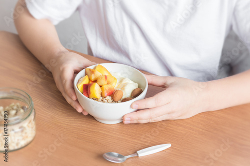 Healthy breakfast bowl in hands