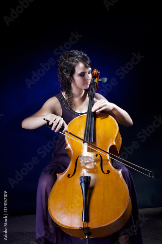 Beautiful girl plays the cello.