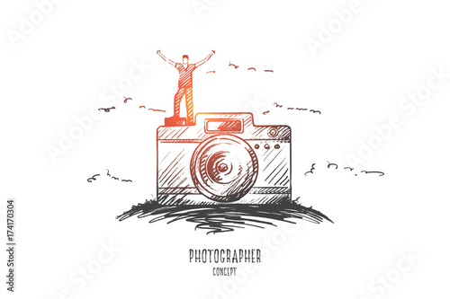 Photographer concept. Hand drawn male photographer standing on camera. Happy person with photo camera isolated vector illustration.