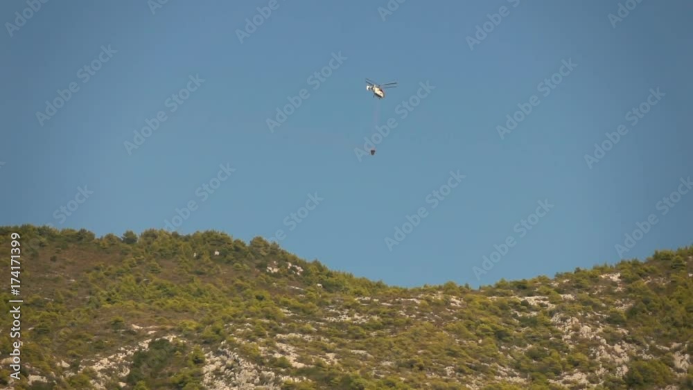 Firefighting helicopter flying over island, super slow motion 240fps
Firefighting helicopter flying over island, super slow motion 240fps