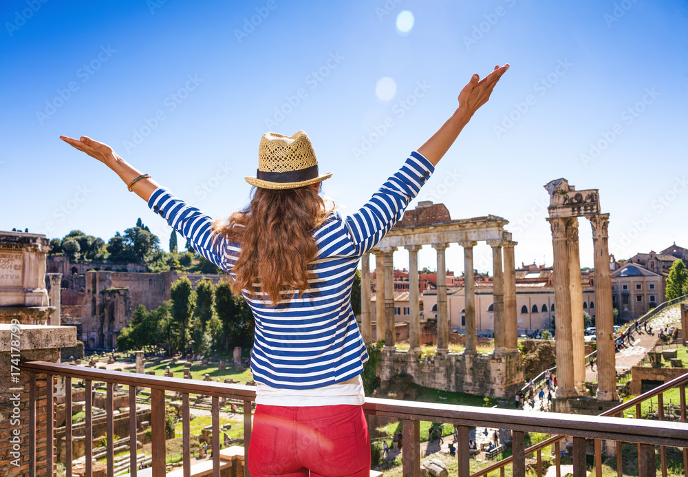Naklejka premium young tourist woman near Roman Forum in Rome, Italy rejoicing