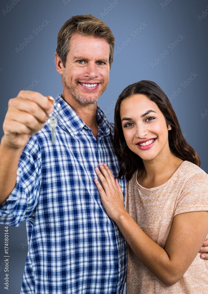 Couple Holding key in front of vignette Couple Holding key in front of vignette