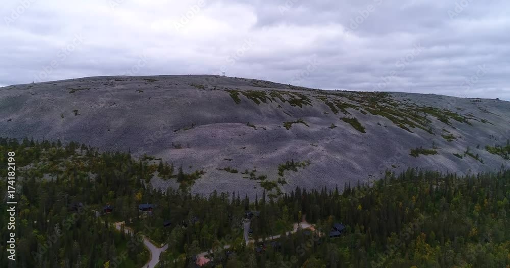 Tunturi mountain, Cinema 4k aerial rising view of luostotunturi fell fjeld, in pyha-luosto national park in Lapland, on a cloudy autumn day, in Lappi, Finland
