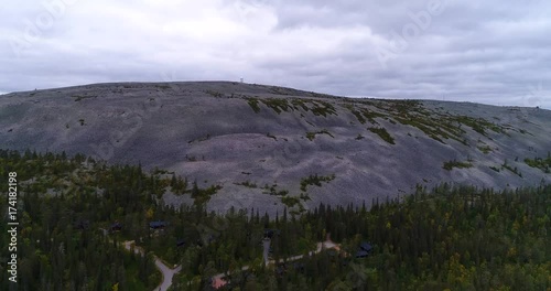 Tunturi mountain, Cinema 4k aerial rising view of luostotunturi fell fjeld, in pyha-luosto national park in Lapland, on a cloudy autumn day, in Lappi, Finland photo