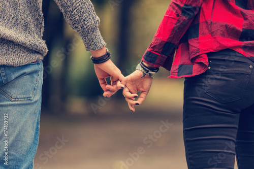 Couple in love holding hands.