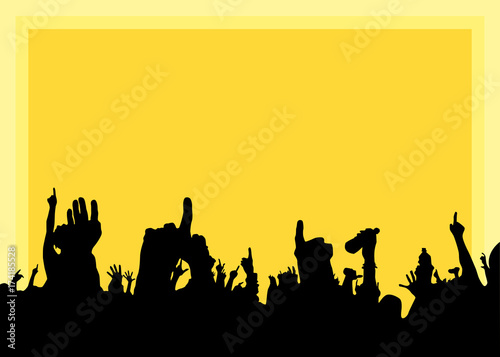 Hands at the concert, silhouettes against stage lighting