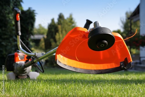 Brush cutter handles with the grass in the court yard