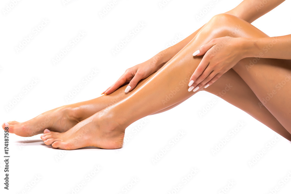 Long Woman Legs isolated on white. Depilation. Cosmetics, health care Long Woman Legs isolated on white. Depilation. Cosmetics, health care