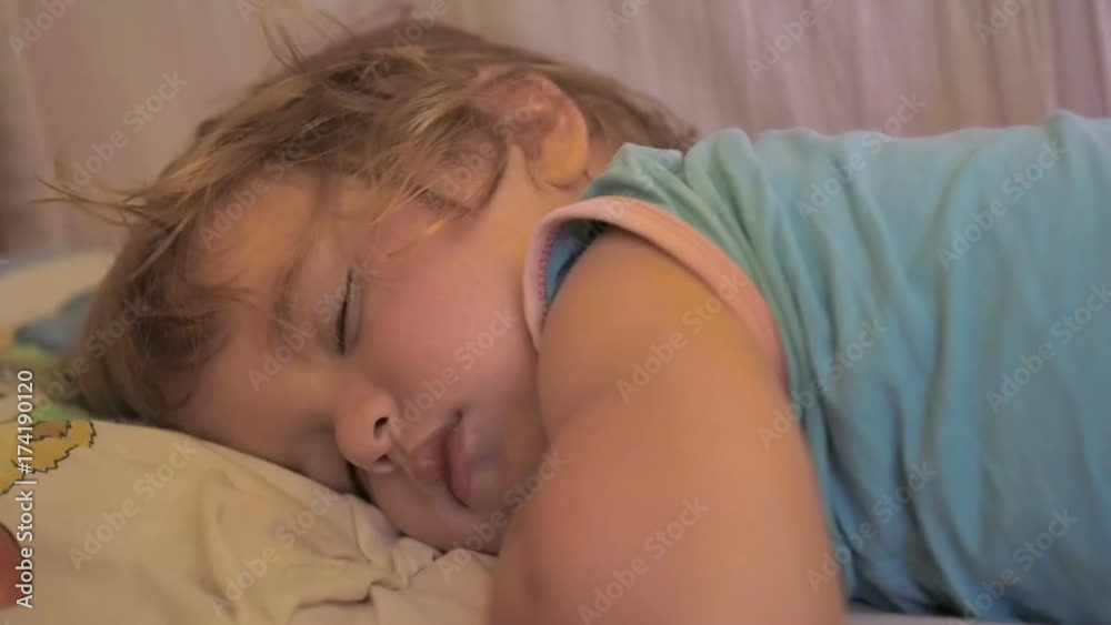 Newborn cute baby sleeping. Close Up portrait, caucasian child. Adorable little boy sleeping in a bed. Newborn cute baby sleeping. Close Up portrait, caucasian child. Adorable little boy sleeping in a bed.
