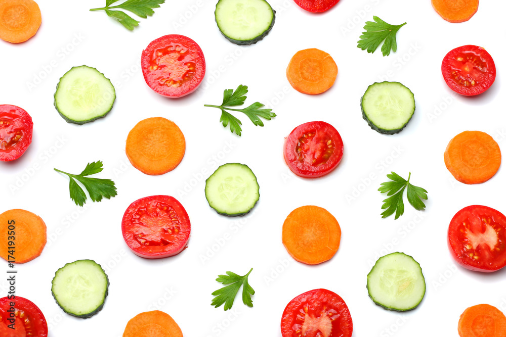 mix of sliced cucumber with sliced carrot and tomato isolated on a white background top view