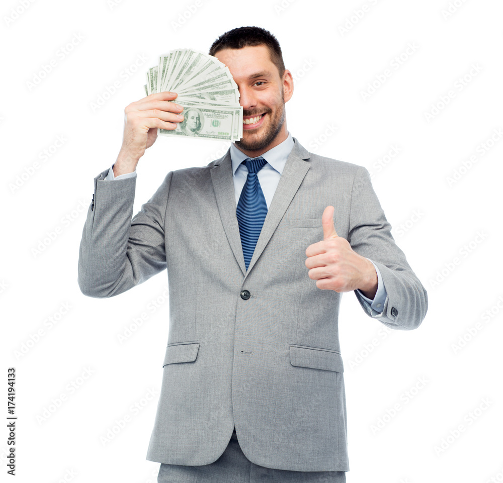 smiling businessman with money showing thumbs up smiling businessman with money showing thumbs up