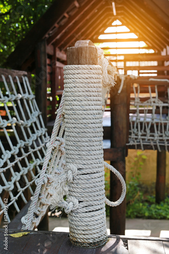 Rope and walk bridge with side rope protection on handrails.
