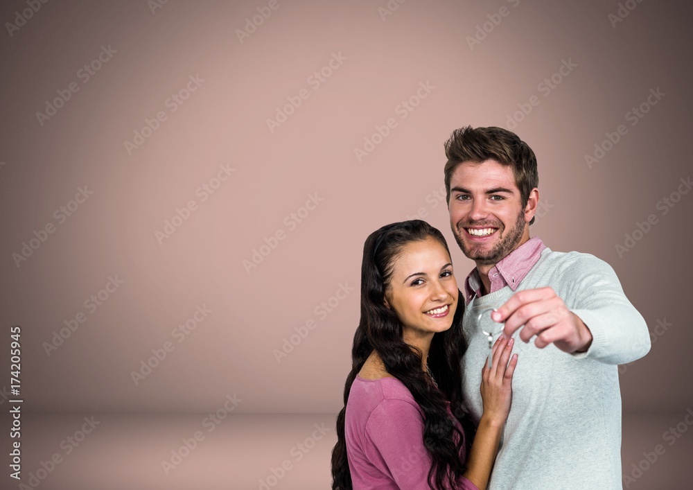 Couple Holding key in front of vignette Couple Holding key in front of vignette