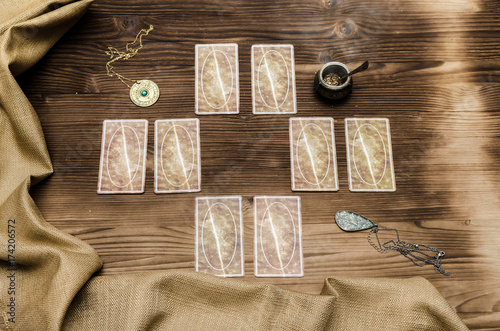 Tarot cards on wooden table. Fortune teller.