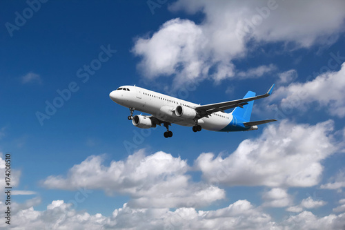 Airplane approaching at the airport, with cloudy background