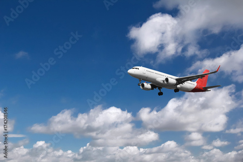 Airplane approaching at the airport, with cloudy background