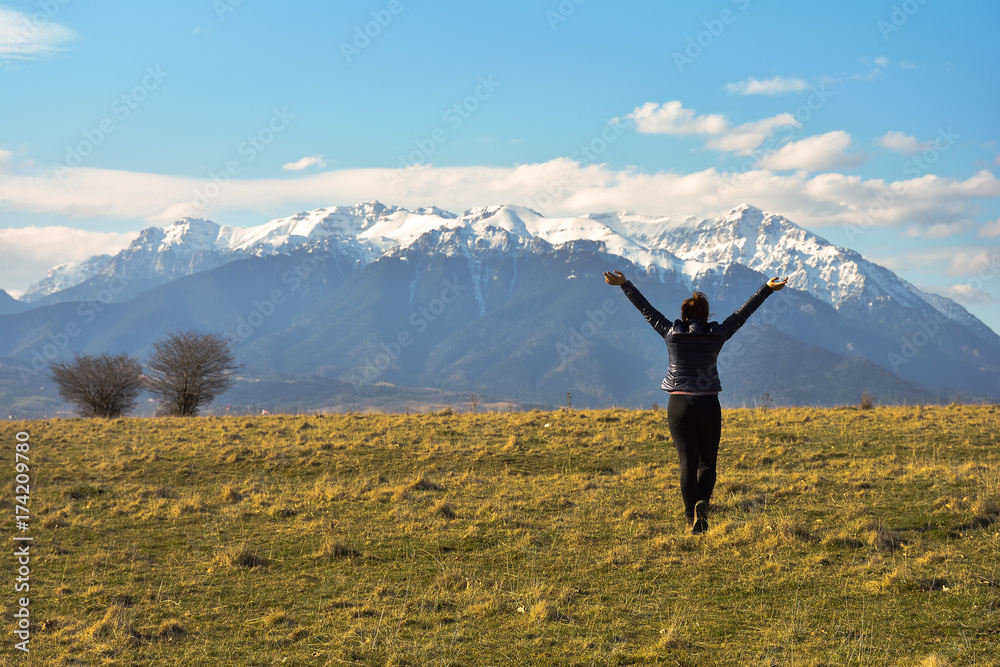 Cheerful woman enjoying the freedom on a sunny day. Cheerful woman enjoying the freedom on a sunny day.