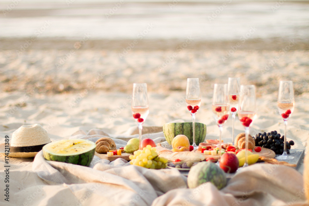Group of friends enjoying  with champagne at the Beach