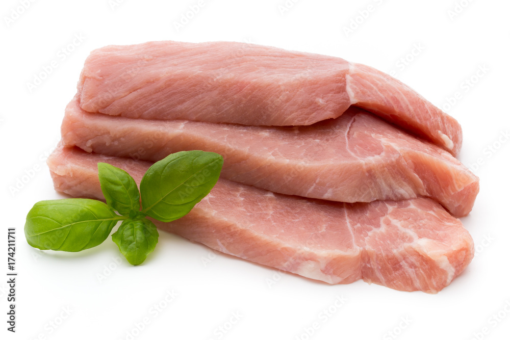 Fresh pork fillet with basil on a white background. Fresh pork fillet with basil on a white background.